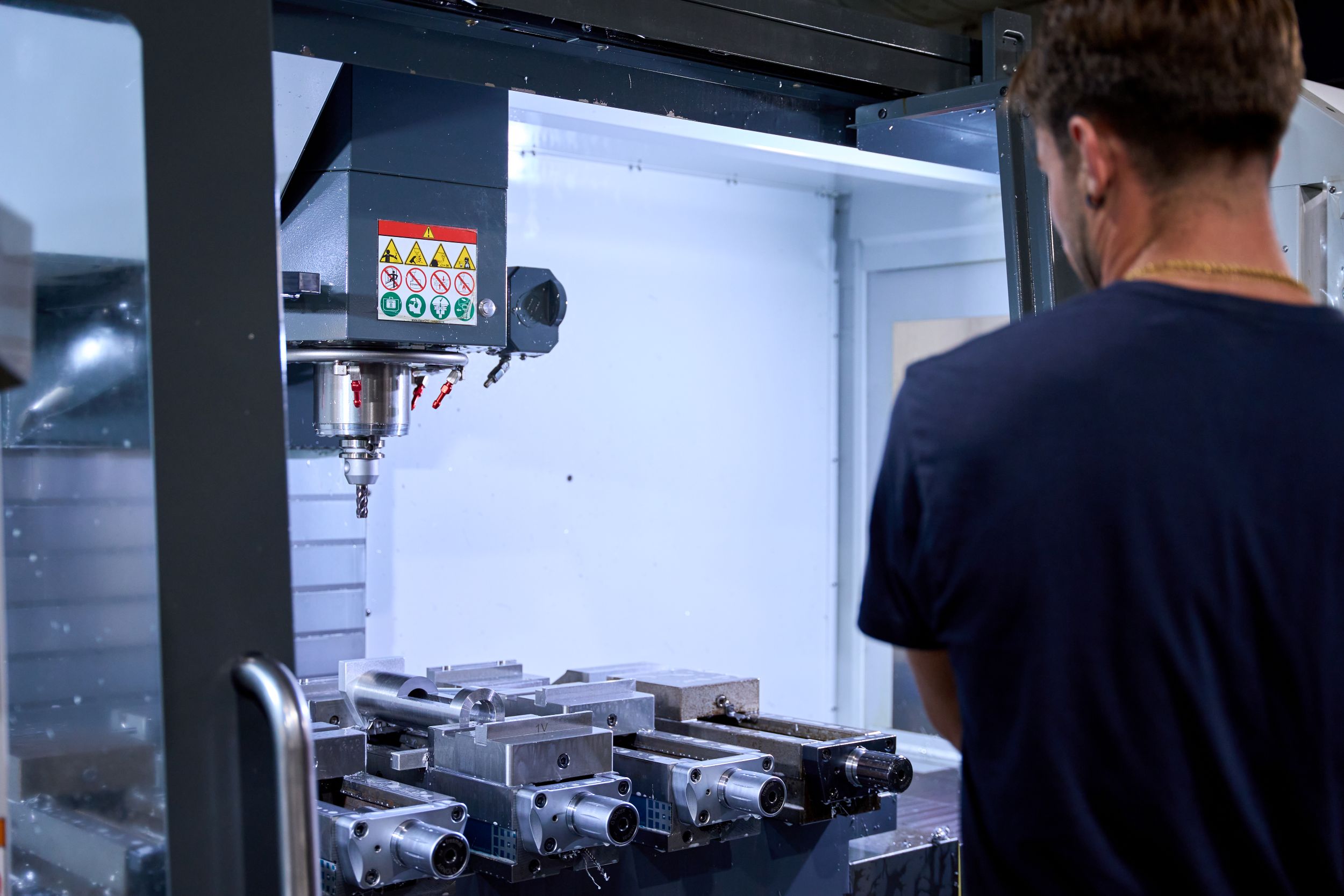 metalworker-operating-cnc-milling-machine-in-facto-2026-01-09-00-59-42-utc